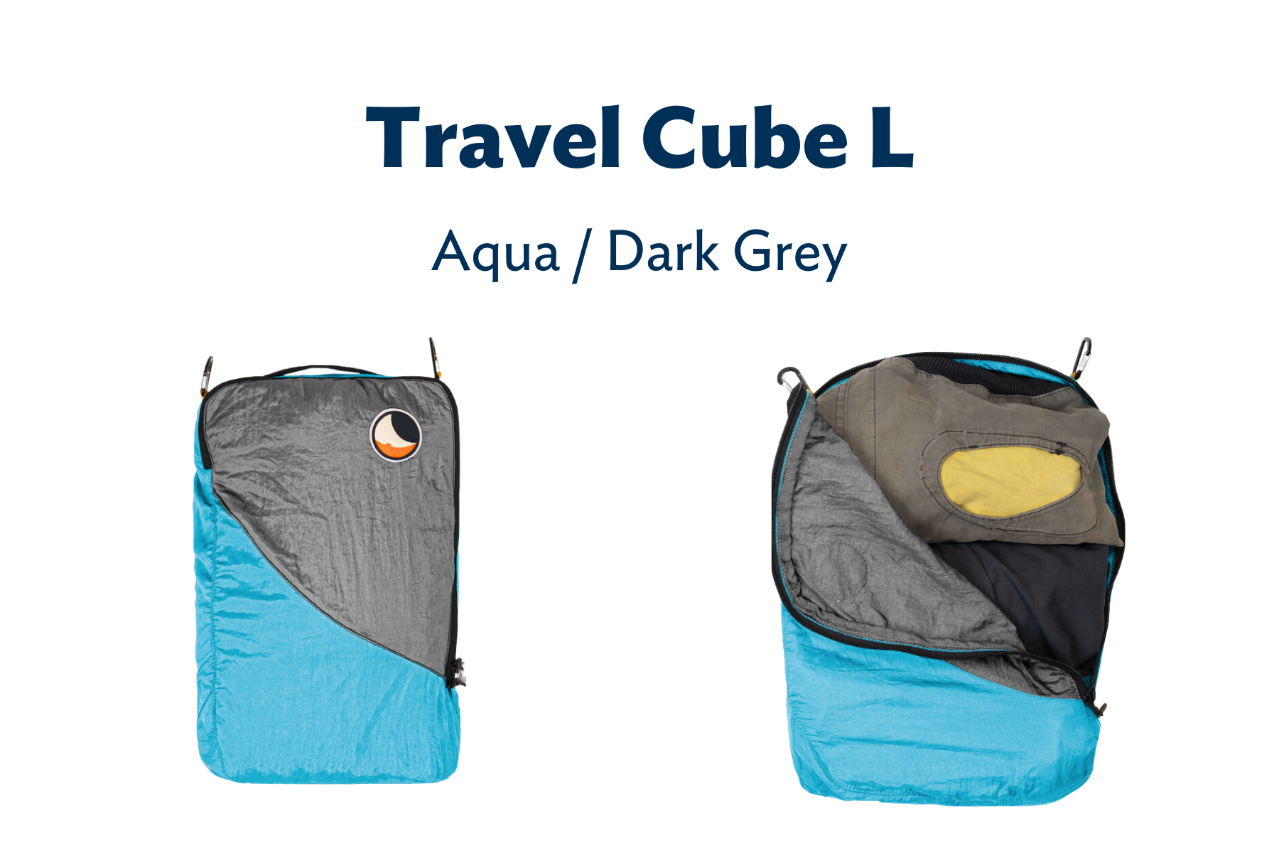 Travel Cube L in Dunkelgrau und Aqua – ein großer Packwürfel geöffnet und mit Kleidung befüllt.