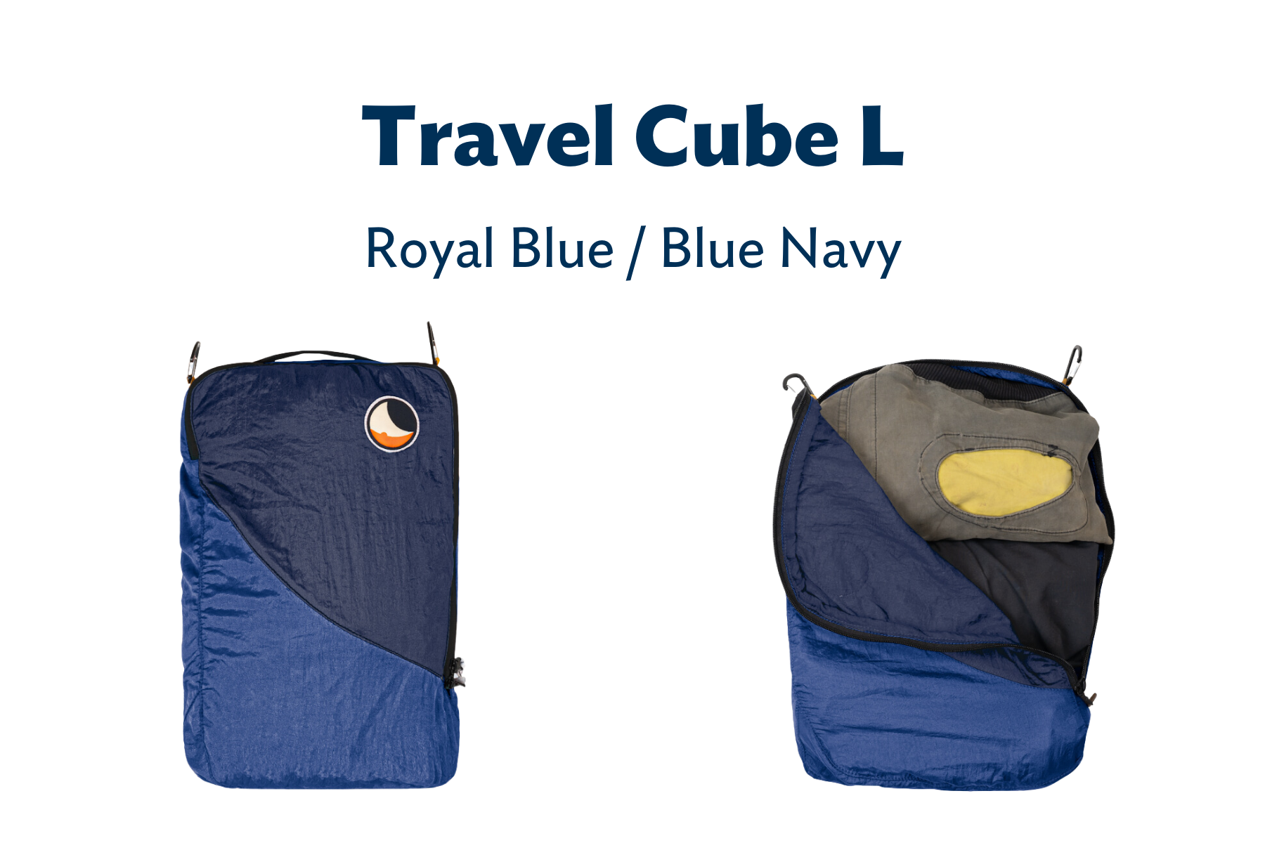 Travel Cube L in Royal und Blue Navy – ein größer Packwürfel geöffnet und mit Kleidung befüllt.