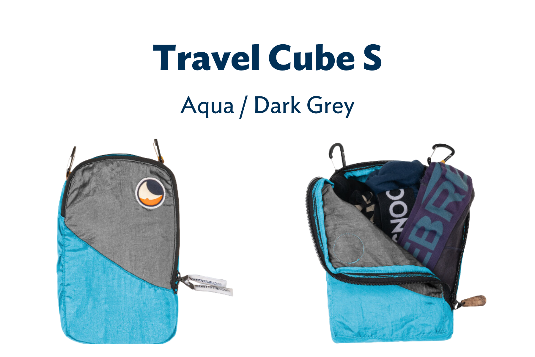 Travel Cube S in Dunkelgrau und Aqua – ein großer Packwürfel geöffnet und mit Kleidung befüllt.